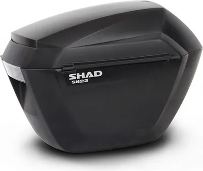 A black motorcycle side case with the brand name SHAD visible.