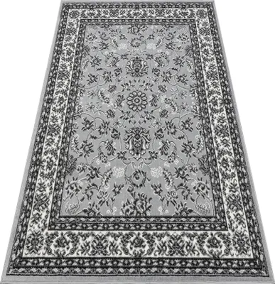 A gray rug with a traditional pattern is shown from a slightly elevated angle against a white background.