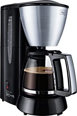 A black Melitta coffee maker with a silver carafe holder and filter basket.
