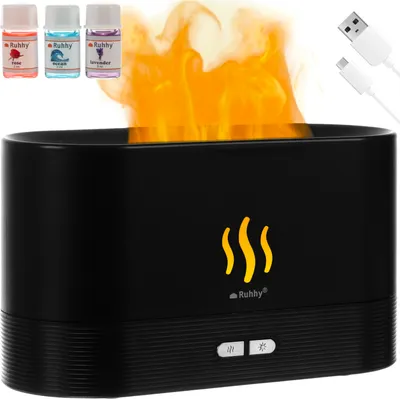 A black aroma diffuser with a flame effect, accompanied by three small bottles of essential oils and two USB cables.