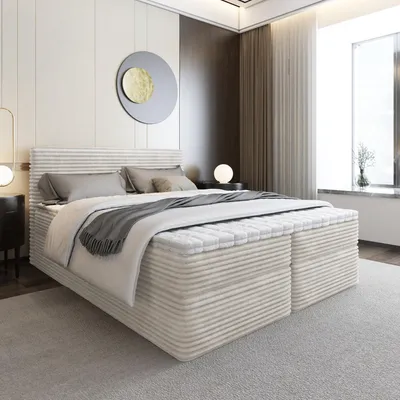A modern bedroom with a large bed, nightstand, and window.