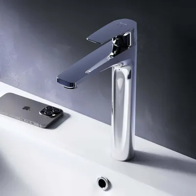 A modern chrome faucet is shown on a white sink, with a smartphone placed next to it.