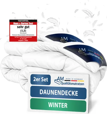 A stack of white duvets with marketing labels and text overlays.