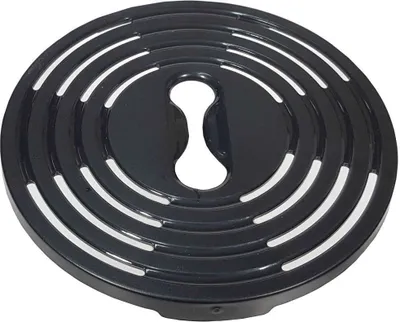 A close-up, slightly angled view of a black circular drip tray with white crescent-shaped openings.