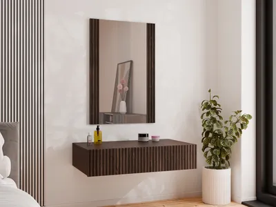 A modern bedroom setting with a wall-mounted vanity and mirror.