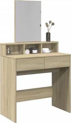 A vanity table with a mirror and some decorative items on top.