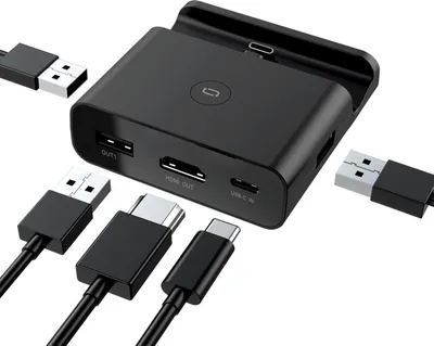 A black docking station with various cables connected to it, presented on a white background.