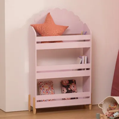 A pink bookshelf with a star-shaped pillow and books.