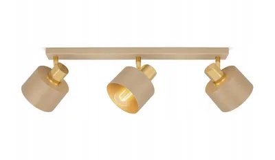 A three-headed ceiling light fixture with beige shades and gold accents, mounted on a light wood bar.