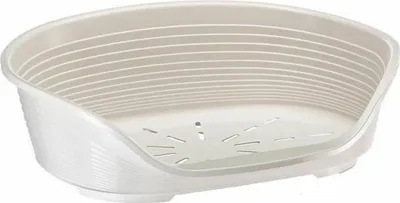 A white plastic dog bed with a raised rim and ventilation holes in the base.