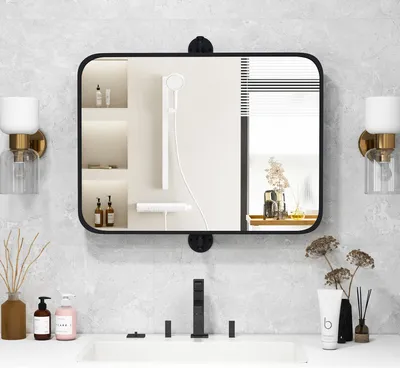 A bathroom vanity with a mirror, sink, faucet, and various toiletries.