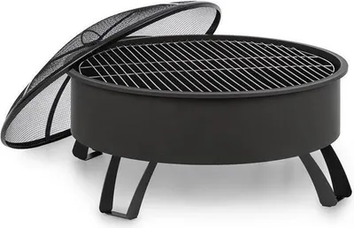 A black metal fire pit with a grill grate and a detached mesh spark screen, shown on a white background.