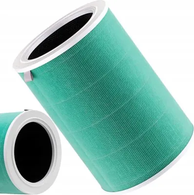 Two cylindrical air filters are shown against a white background. One filter is in the foreground, angled diagonally, and the other is partially visible in the lower left corner.