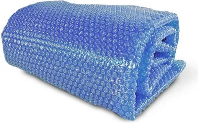 A folded blue solar cover for a pool.