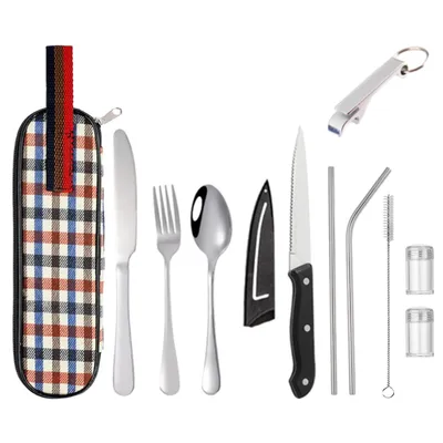 A set of camping cutlery and accessories laid out on a white background.