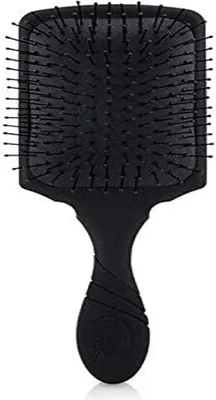 A black paddle hair brush is shown against a white background.