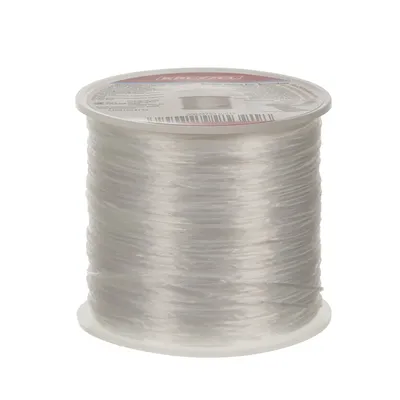 A spool of clear elastic cord on a white background.