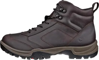 A side view of a brown leather boot on a white background.