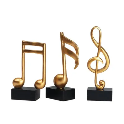 Produktbild von Goldene Musiknoten im 3er-Set auf schwarzem Sockel