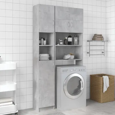 A bathroom or laundry room setting with a washing machine and storage cabinets.