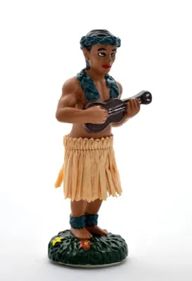 A figurine of a Hawaiian boy playing a ukulele, standing on a green base.