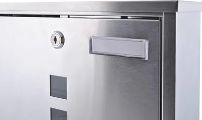 A close-up view of a modern stainless steel mailbox.