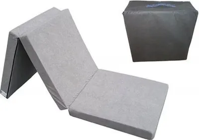 A gray folding mattress laid out flat, with a folded version of the mattress in the background.
