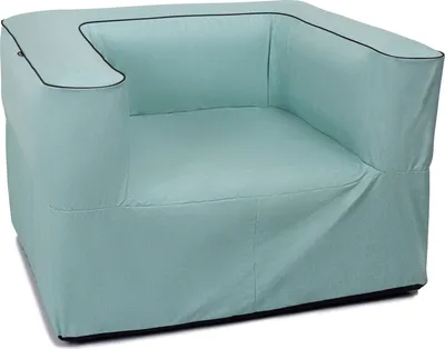 A light green lounge sofa with dark trim.