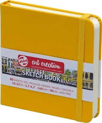 A yellow sketchbook with a descriptive band around it.