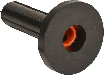 A close-up studio shot of a black and orange plastic anchor plug with a rubber flange.