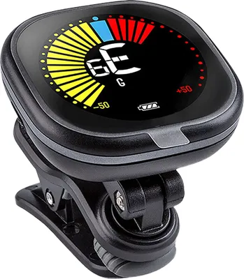 A close-up of a digital clip-on tuner for musical instruments, showing its display screen and clip mechanism.