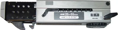 A close-up, top-down view of a metal tool attachment on a white background.