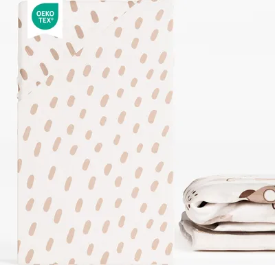 A folded fitted sheet with a cute tiger spot pattern and an OEKO-TEX certification label.
