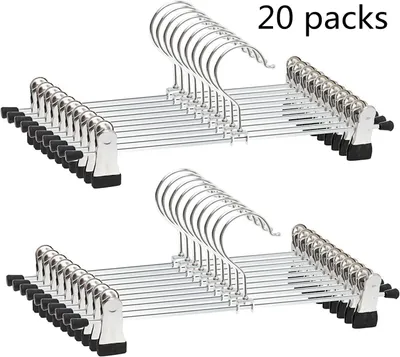 Two stacks of metal hangers with black clips, with the text '20 packs' in the top right corner.