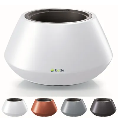 A white planter with a dark interior, shown from a slightly elevated angle. Below the main planter are four smaller examples in different colors: white, copper, gray, and dark gray.