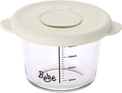 A baby food container with measurement markings and a lid.