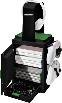 A black gaming locker with white headphones on top, white controllers on the side, and game cases inside.