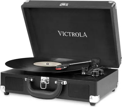 A black Victrola record player is shown with its lid open, displaying a vinyl record on the turntable.