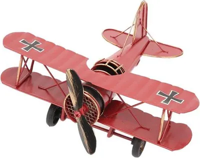 Produktbild von Retro-Flugzeug-Modell aus Metall, handgefertigt, klein, rot.