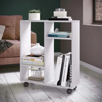 A white shelving unit with books and decorative items is placed next to a sofa in a living room.