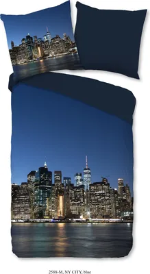 A duvet cover and pillowcase set featuring a nighttime view of the New York City skyline.