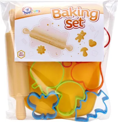 A baking set for children, including a rolling pin and various shaped cookie cutters, is displayed inside its clear plastic packaging.
