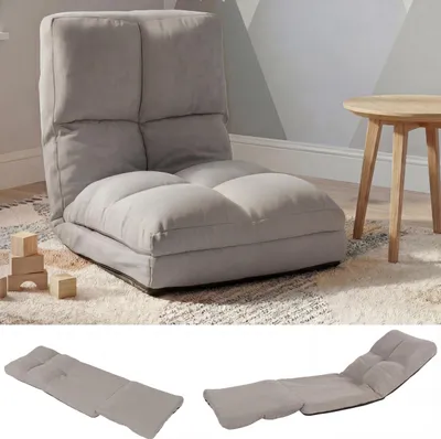 A light gray floor chair is shown in a room with a wooden table and children's blocks. The bottom of the image shows the chair in a flattened state.