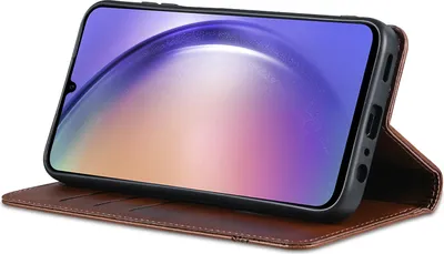 A brown leather flip case for a smartphone, shown standing up with the phone screen visible.