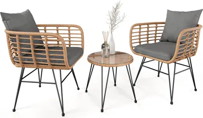 A set of two chairs and a table with a white background.