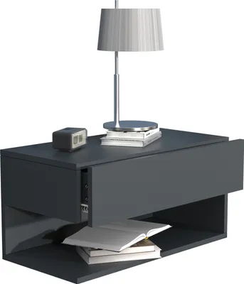 A modern, dark gray floating nightstand with an open shelf and a drawer. A table lamp and a small digital clock are on top, and books are in the shelf.