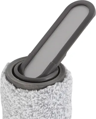 Close-up of a cleaning brush head and roller.
