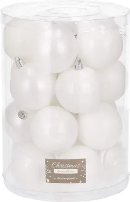 A clear, well-lit studio shot of a clear plastic container filled with white Christmas ornaments.