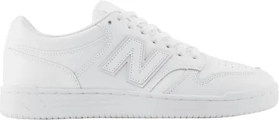 A white New Balance sneaker is shown from the side against a white background.