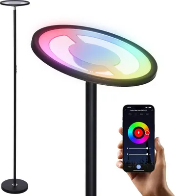 A modern RGB floor lamp with a smartphone app interface shown in the foreground.